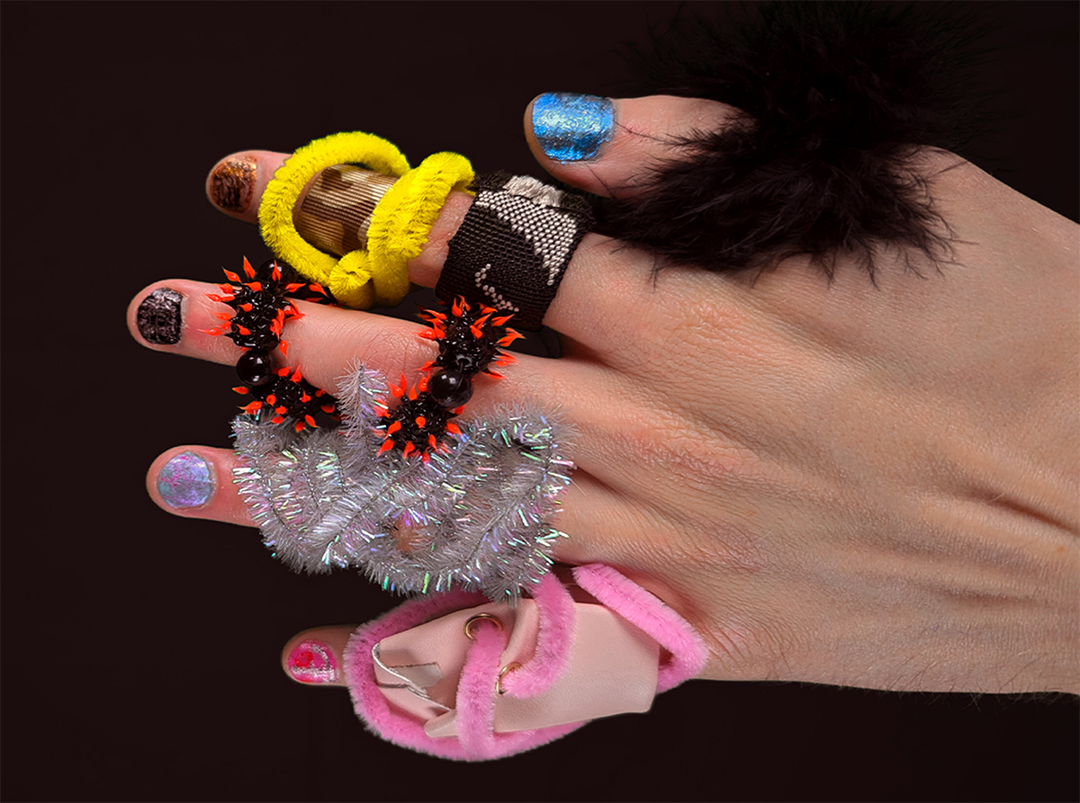 The five fingers in "Pinkie" as characters with paint and costumes.