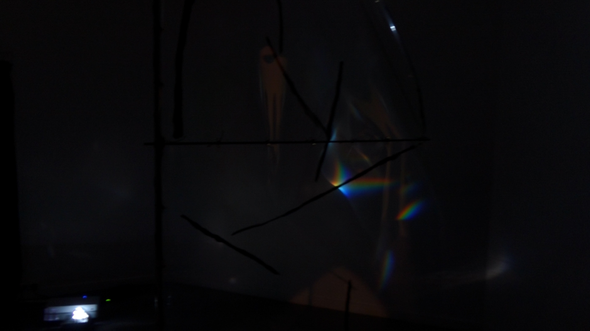 Detail view of refracted spectral light on a translucent foil sail.