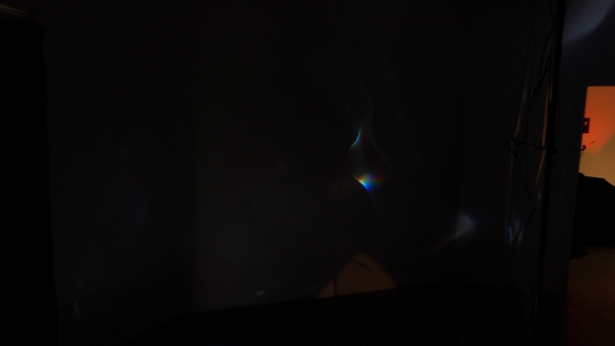 Detail view of refracted spectral light on a translucent foil sail.